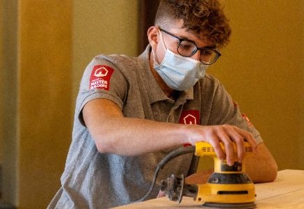 Student sanding wood