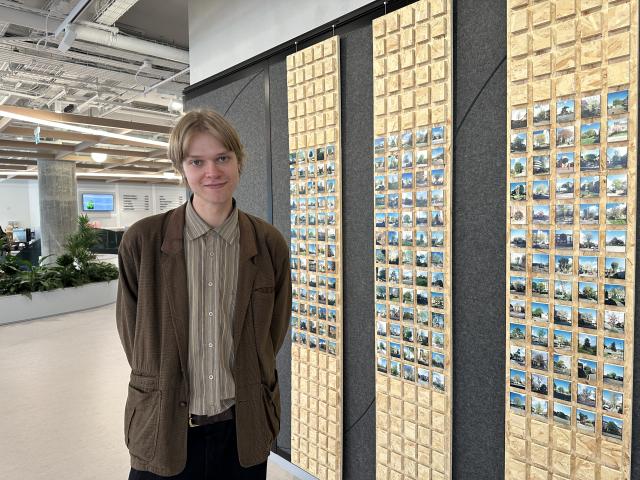 Kingston University photography student Alexander Talver with his artwork at Unilevers Kingston campus