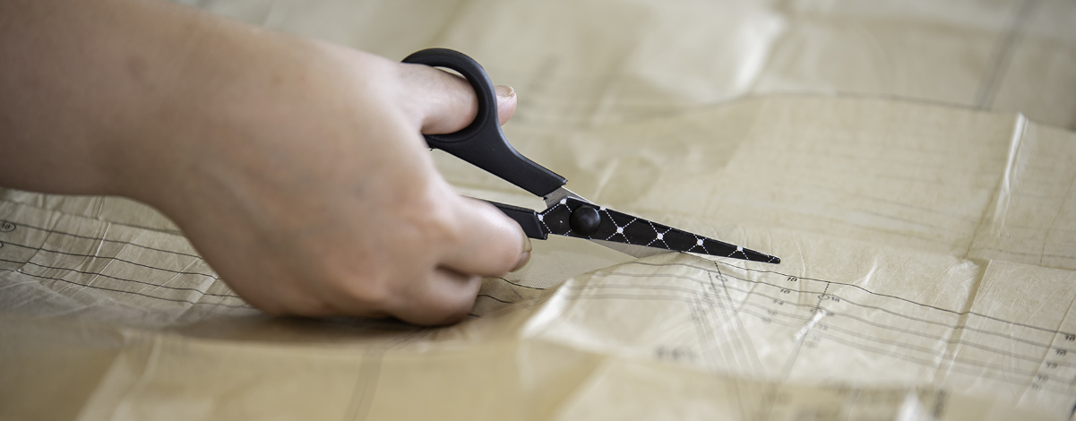 Student cutting with scissors