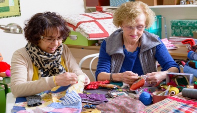 Mature students knitting