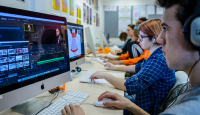 Student using video editing software